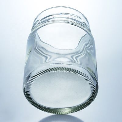 Προσαρμοσμένο 500 ml Γυροειδές γυάλινο βάζο με μέλι και γυάλινο υλικό βάσης