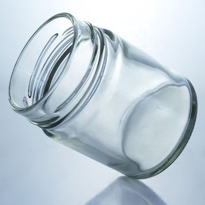 Προσαρμοσμένο 500 ml Γυροειδές γυάλινο βάζο με μέλι και γυάλινο υλικό βάσης