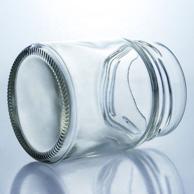 Προσαρμοσμένο 500 ml Γυροειδές γυάλινο βάζο με μέλι και γυάλινο υλικό βάσης